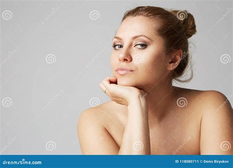 Beautiful Girl With Big Eyes And Dark Eyebrows With Naked Shoulders Looking At Camera Model