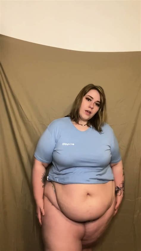 BBW Blonde Shakes Her Big Belly While Putting Shirt On