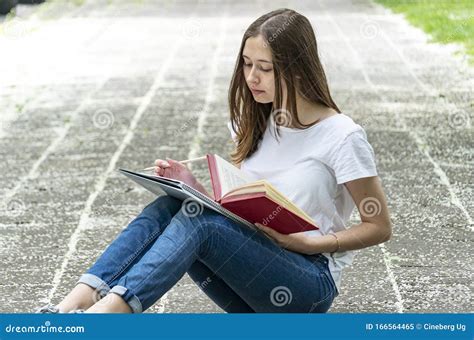 Teenage Girl Reading a Book Outdoors Stock Image - Image of nice ...