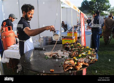 Food Festival in Rawalpindi Pakistan A person preparing Pakistan food