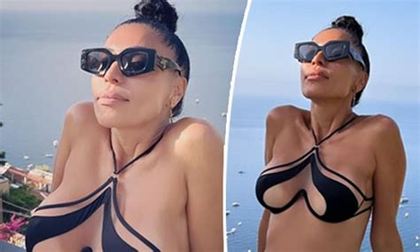 Would You Wear This To The Beach DJ Turns Heads As She Shows Off Her Cleavage In A Wild Nude