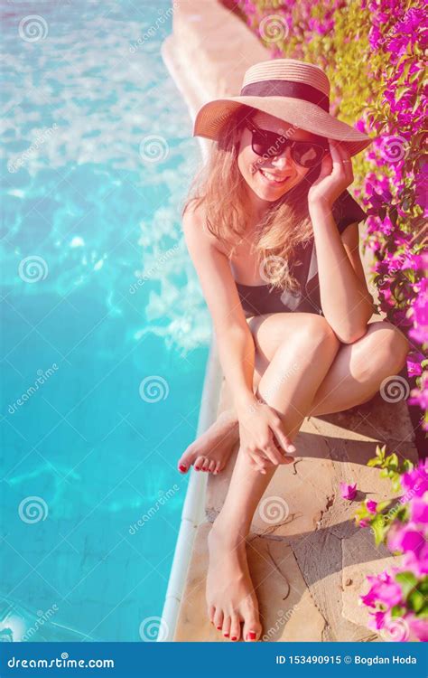 Beautiful Woman Enjoying Sunbathing By The Pool Summer Concept Of Brunette Latina Laying At Sun
