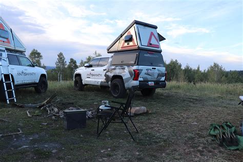 Hard-sided pickup camper hauls gear like a truck, camps like a cabin