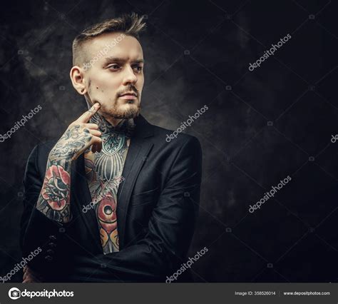 Cool Tattoo Artist Male Model Posing In A Dark Studio With Half Naked