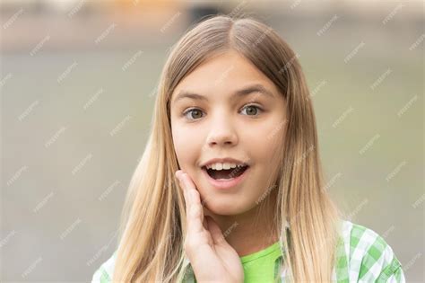 Premium Photo Portrait Of Tween Girl With Surprised Face Holding Hand