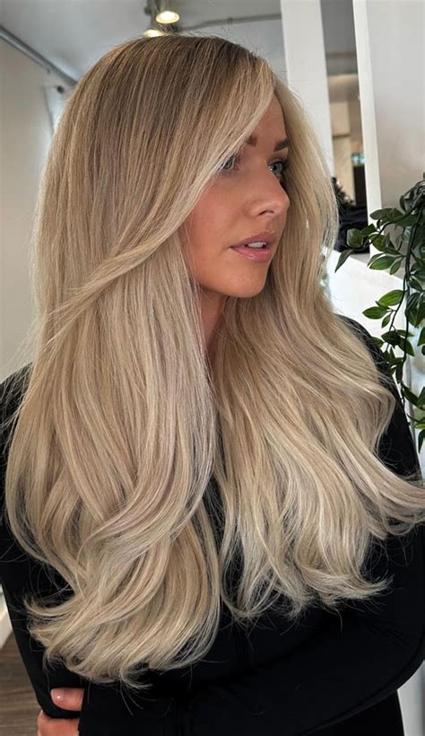 Soft Buttercream Old Money Blonde Hairstyle With Classic Layers