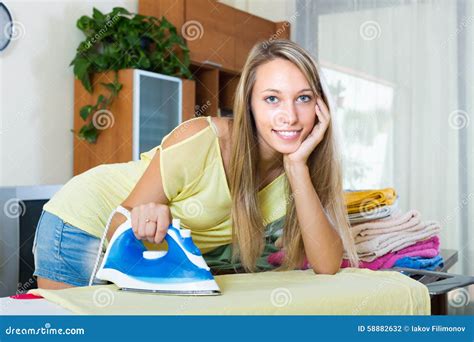 Blonde Woman Ironing At Home Stock Photo Image Of Board Smoothing