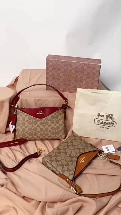 HOT กระเปาสะพายไหล สะพายขางโคช มมาใหทงสายสนและยาวหรอถอดสายถอกได ปมโลโกชดทก