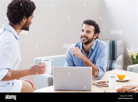 Happy Gay Couple Using Laptop Stock Photo Alamy