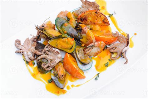 Delicious mixed seafood plate with citrus sauce 46792995 Stock Photo at