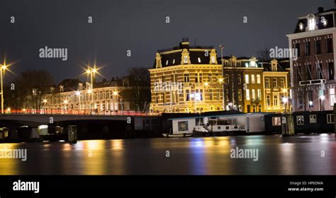 Amstel river in Amsterdam at night Stock Photo - Alamy