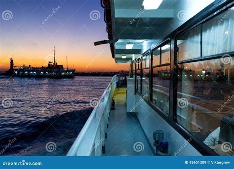 Reflection Of A Sunset In The Windows Of The Passenger Ferry Stock