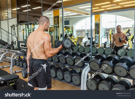 Muscular Man Naked Torso Trains Biceps Stock Photo 1875192718 Shutterstock