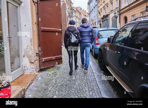 Happy Mature Couple Hand Holding Walking In Old Touristic City Pavement Sidewalk Stock Photo Alamy