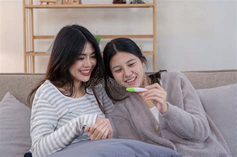 Lesbian Couple Celebrating Ivf Journey Home Setting Lifestyle Intimate Environment Joyful