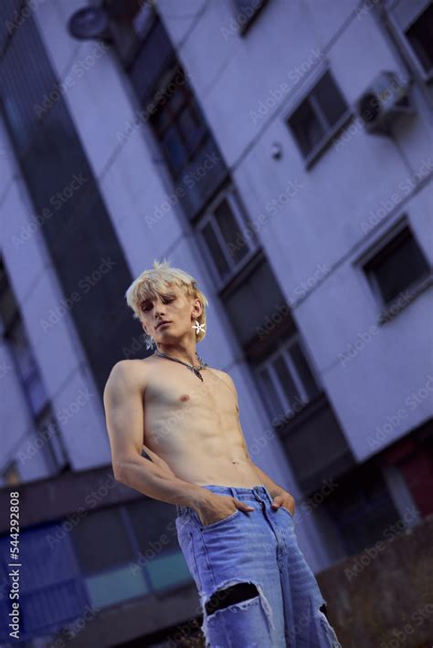 Portrait of a blonde shirtless teenage boy in the urban exterior Stock 写真 Adobe Stock
