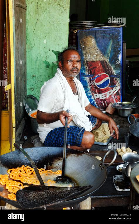 An Indian man cooking street food Stock Photo - Alamy