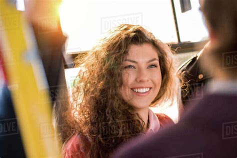 Beautiful Brunette Girl With Curly Hair Smiling In City Bus Royalty Free Stock Photo Dissolve