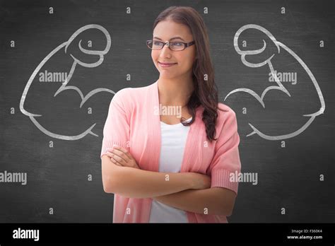 Composite Image Of Pretty Brunette Smiling With Arms Crossed Stock Photo Alamy