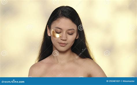 Closeup Studio Shot Of Beautiful Female Model Brunette Girl With Long Hair And Nude Makeup