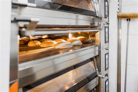 Bread Baking Bread In Oven At Commercial Kitchen Stock Photo