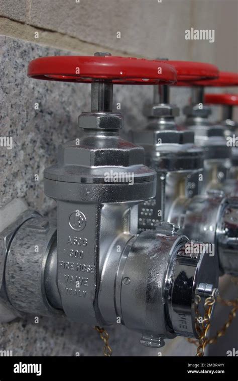 Fire Hose Valves With Red Handle On A Wall Stock Photo Alamy