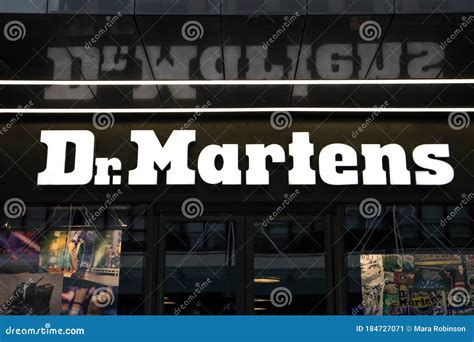 Exterior View Of Dr Martens Shoe Footwear Shop Showing Logo And Signage