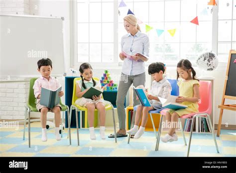 Foreign Teacher And Kindergarten Children Stock Photo Alamy