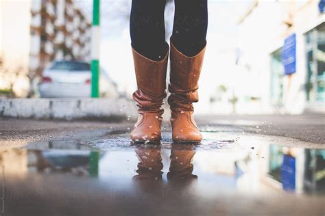 Boots In A Puddle By Stocksy Contributor Tommaso Tuzj Stocksy