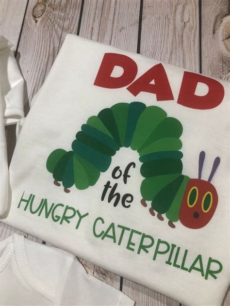 The Very Hungry Caterpillar Onesuit Is Next To Its Dad S T Shirt