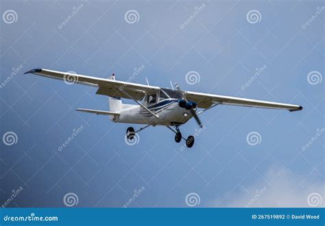 single prop engine small airplane flying  blue skies stock photo