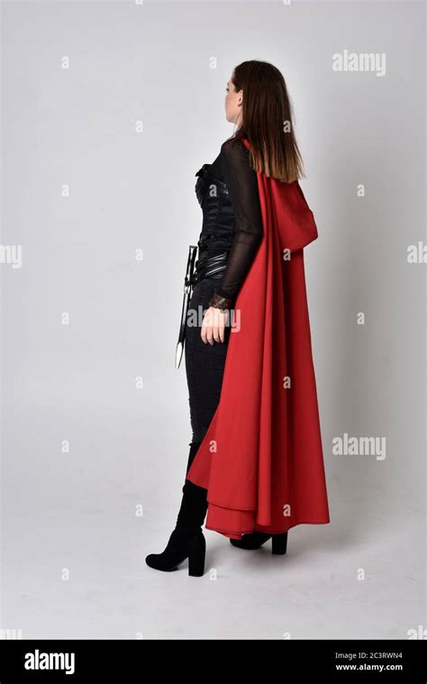 Portrait Of Brunette Girl Wearing Black Leather Catsuit Full Length Standing Pose Isolated