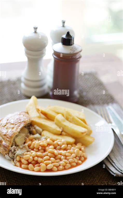 Traditional British Cornish Pasty With Chips And Baked Beans In Tomato