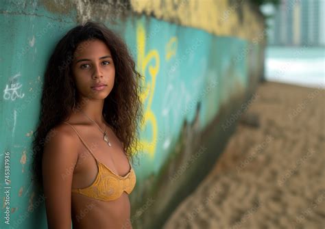 Slim Brazilian Girl In A Bikini Top At The Beach Posing A Beautiful