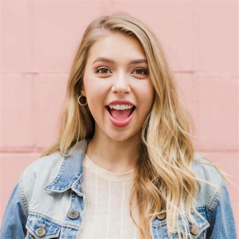Premium Photo A Blonde Woman Wearing A Denim Jacket Is Posing For A Photo