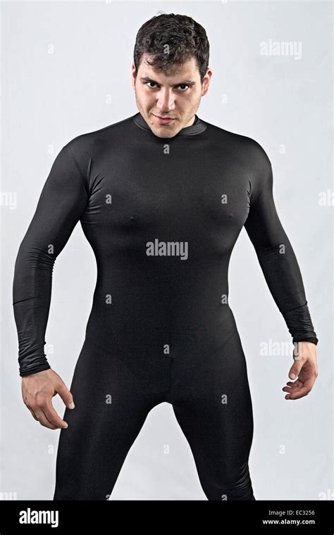 Young Male With Black Hair Wearing Tight Fitting Black Body Suit Stock