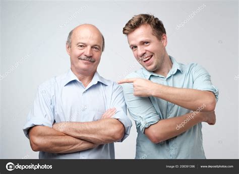 Handsome Mature Son Proud His Senior Father Pointing Him Saying Stock Photo By Koldunova Anna