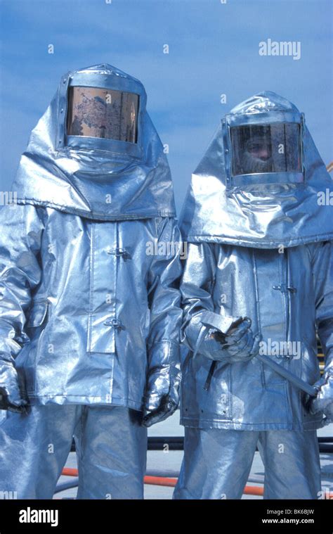Firefighters In Heat Resistant Suits Stock Photo Alamy