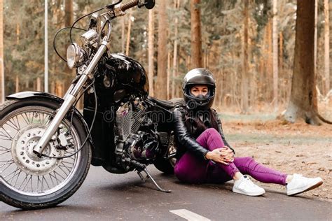 Beautiful Brunette Riding A Motorcycle In The Park Stock Image Image