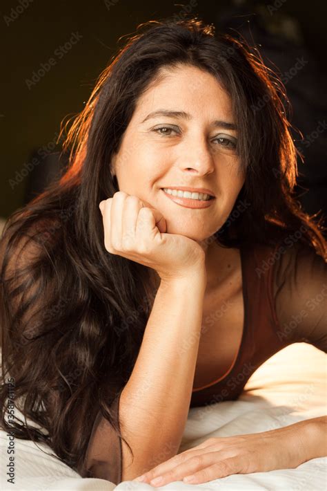 Attractive And Pretty Spanish Brunette Long Hair Brunette Woman With Clear Green Eyes Lying On