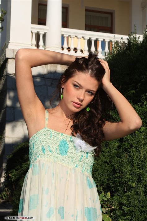 Sexy Brunette Teases Outdoors With Nice Round Tits Photos