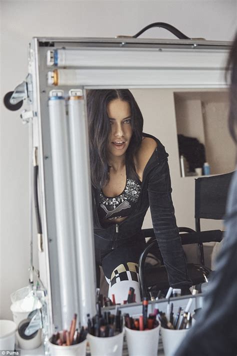 Adriana Lima Works Her Magic In Nude PVC Trousers And Tight Turtleneck As She Films Maybelline