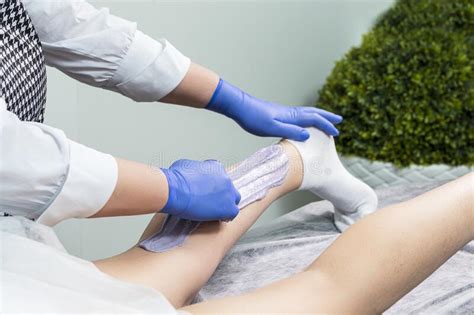 Worker Beautician Depilation With Hot Wax Woman S Leg In Beauty Spa Body Hair Removal Stock