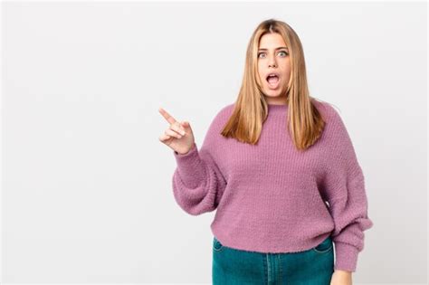 Premium Photo Curvy Pretty Blonde Woman Looking Very Shocked Or Surprised