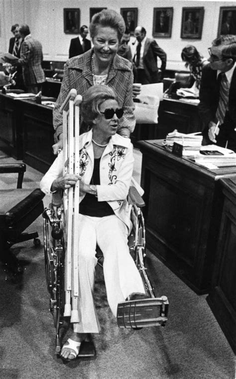 Florida Memory • Senator Lori Wilson In Wheelchair Being Excorted By A