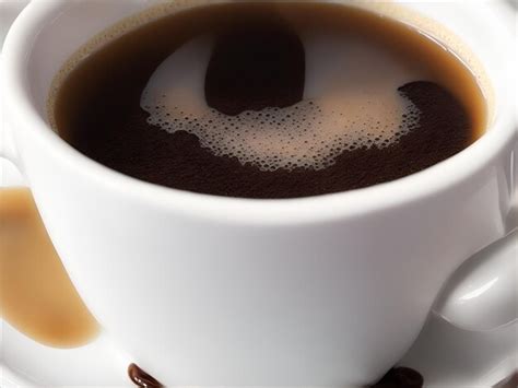 Premium Ai Image A Closeup Of A Steaming Cup Of Freshly Brewed Coffee