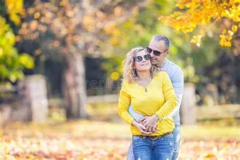 Happy Mature Couple In Autumn Park In The Embrace Stock Photo Image Of Husband Nature