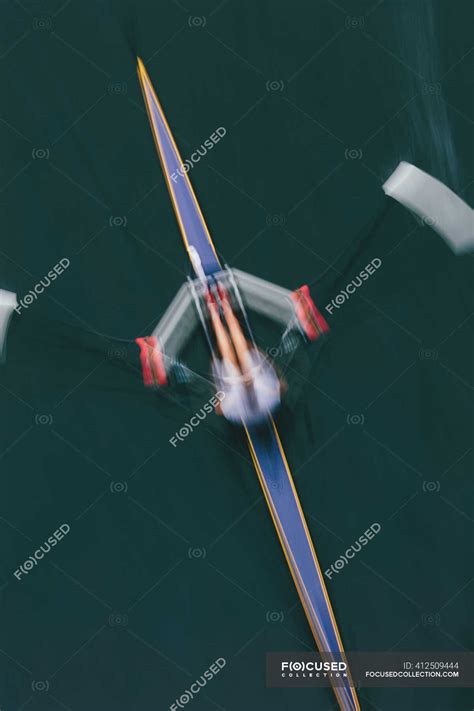 single scull boat  rower   water view   motion