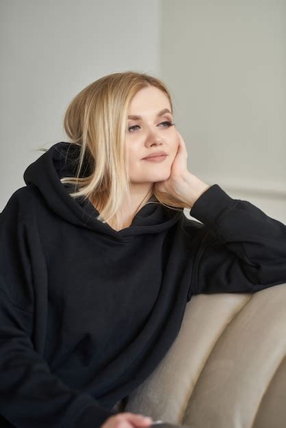Premium Photo Beautiful Blonde Sitting On The Sofa