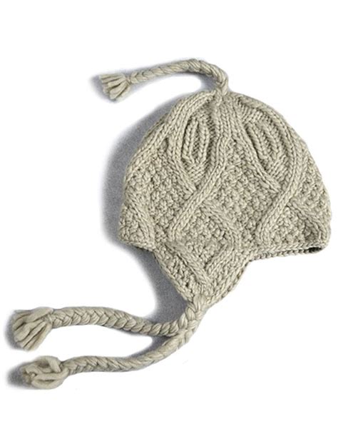 A White Knitted Hat On A White Background